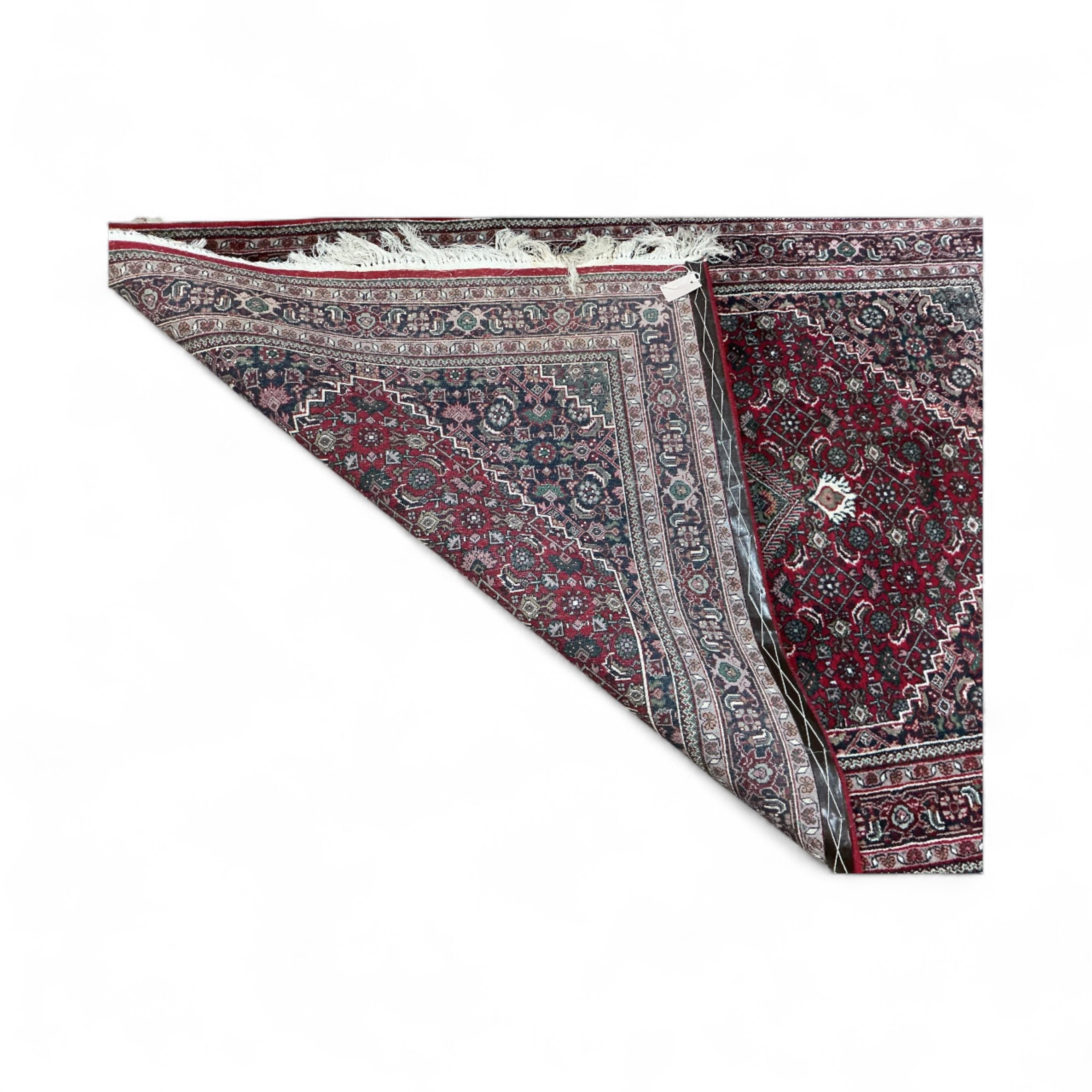 A North West Persian red ground rug